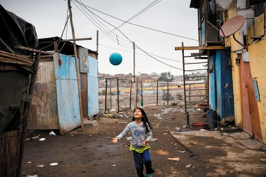 A girl from the Shipibo ethnic group plays in the Cantagallo neighborhood of Lima, Peru. 